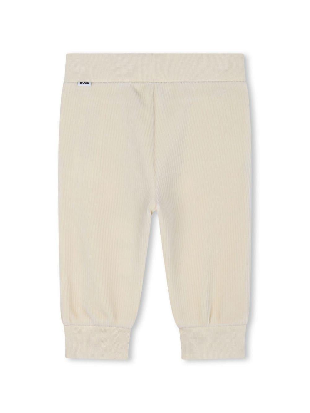 Pantaloni sportivi con applicazione per neonato BOSS Kidswear beige con design a coste - Rubino Kids