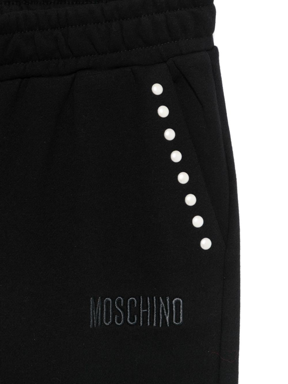 Pantaloni sportivi con borchie per bambina Moschino Kids neri con dettaglio borchiato - Rubino Kids