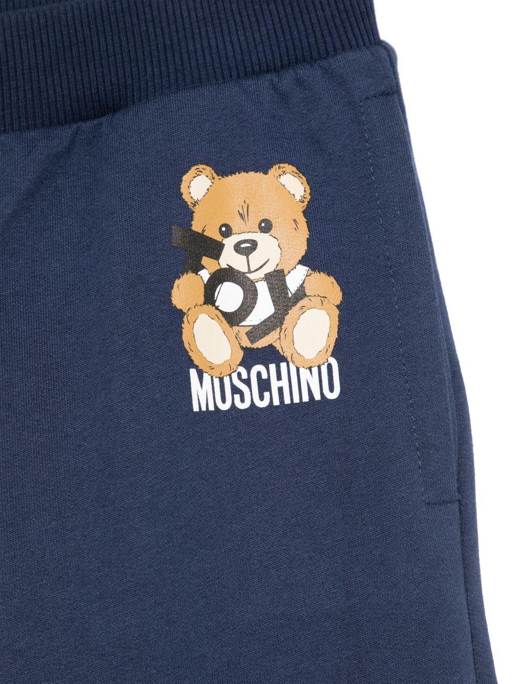 Pantaloni sportivi in cotone per bambino Moschino Kids blu con orli a coste - Rubino Kids