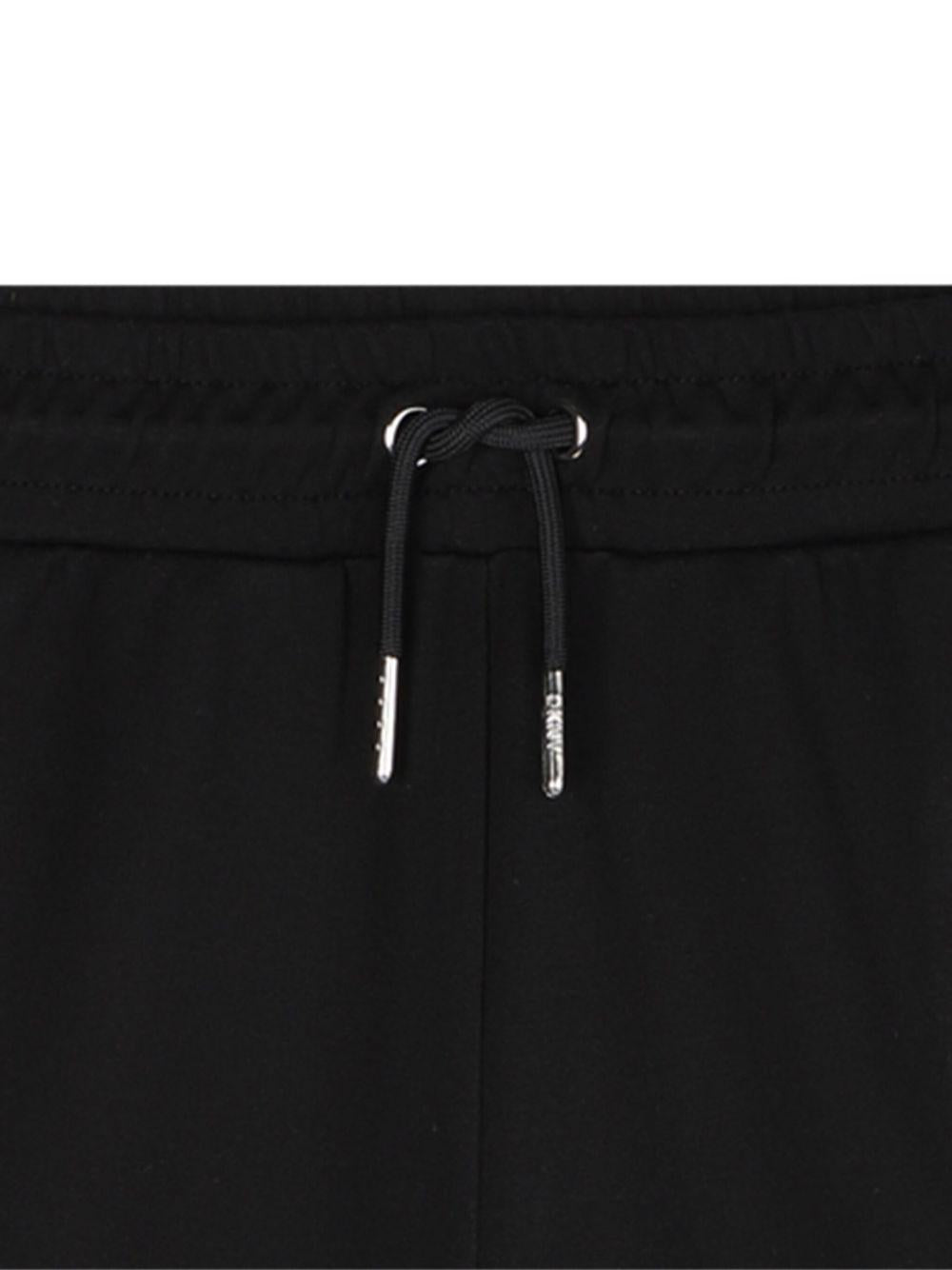 Pantaloni sportivi per bambina DKNY Kids neri con logo - Rubino Kids