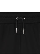 Pantaloni sportivi per bambina DKNY Kids neri con logo - Rubino Kids