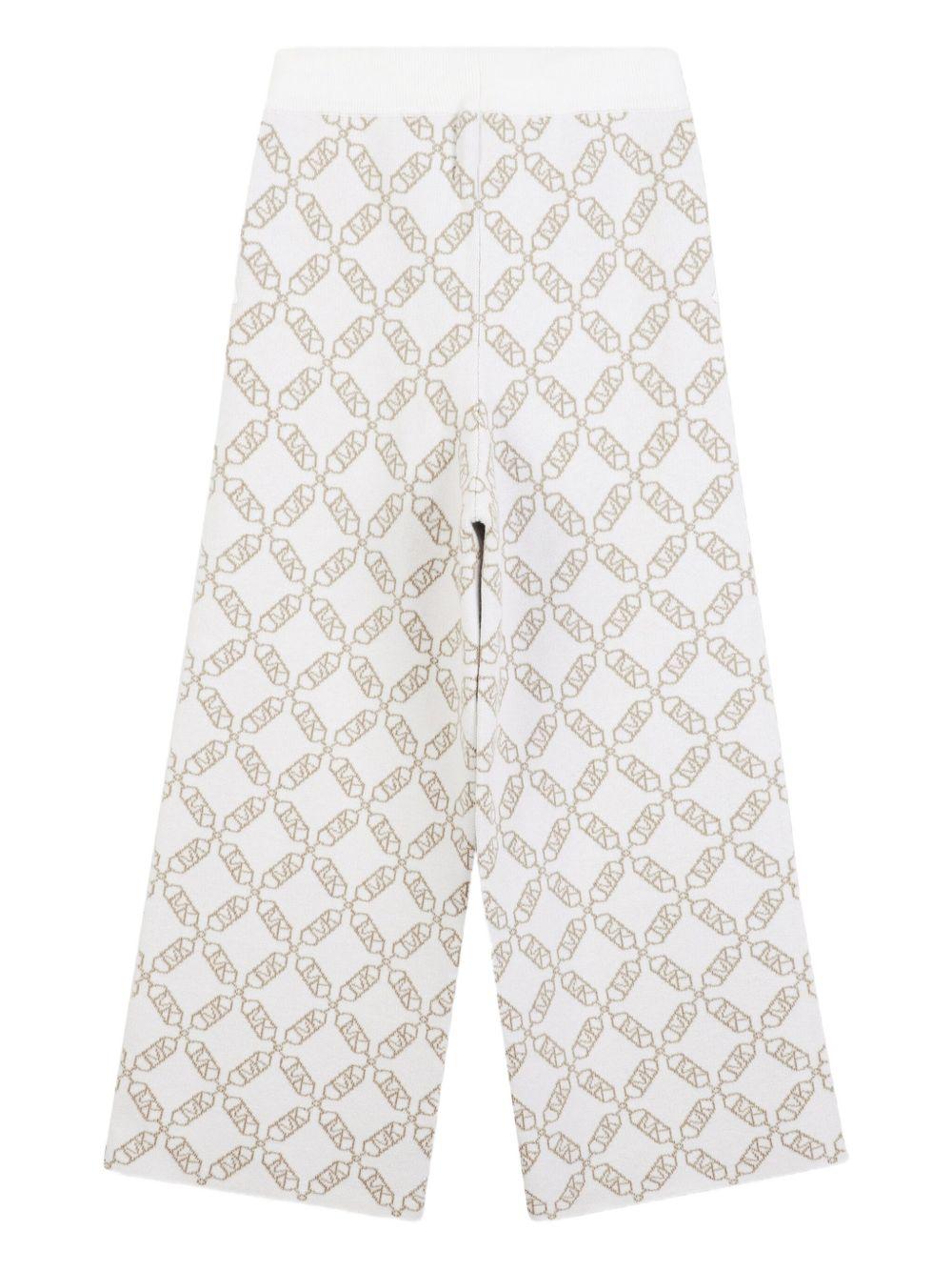 Pantaloni sportivi per bambina Michael Kors Kids bianchi con monogramma - Rubino Kids