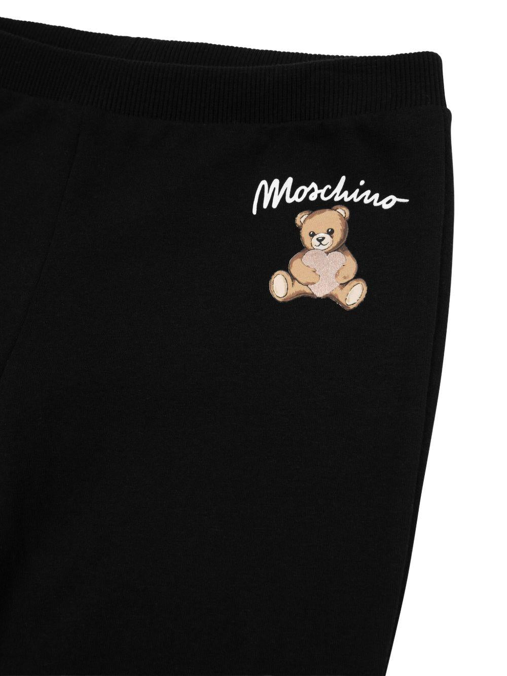 Pantaloni sportivi per bambina Moschino Kids neri con stampa con logo - Rubino Kids