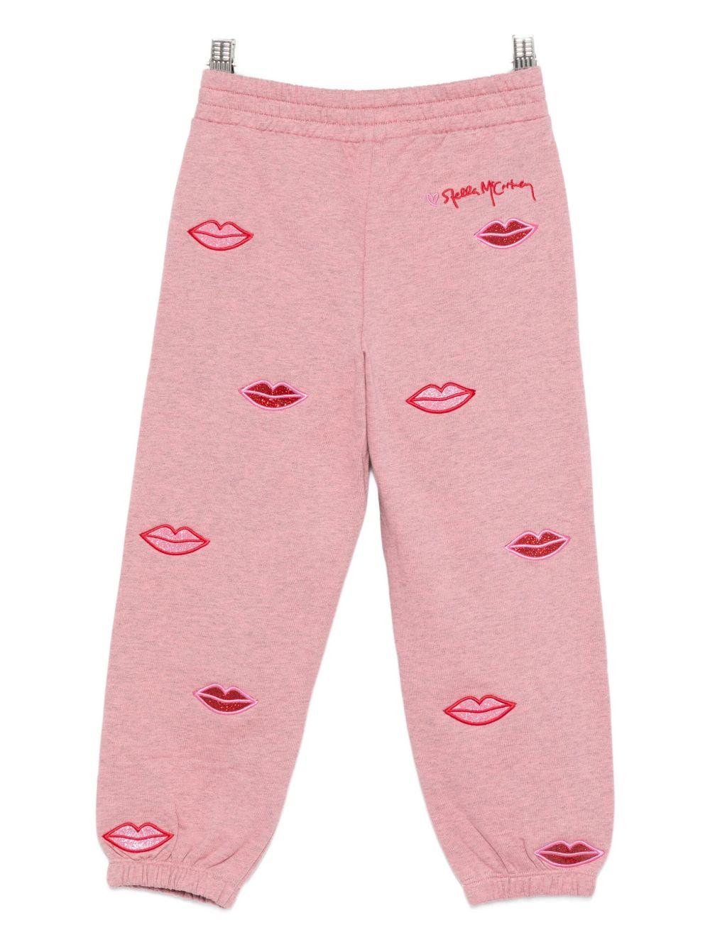Pantaloni sportivi per bambina Stella McCartney Kids rosa con stampa bacio - Rubino Kids