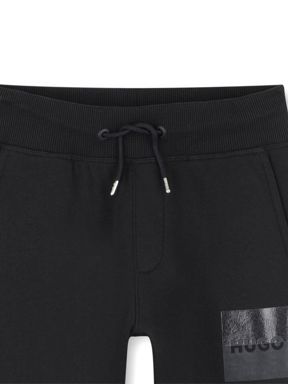 Pantaloni sportivi per bambino Hugo Kids neri con vita elasticizzata - Rubino Kids