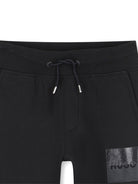 Pantaloni sportivi per bambino Hugo Kids neri con vita elasticizzata - Rubino Kids