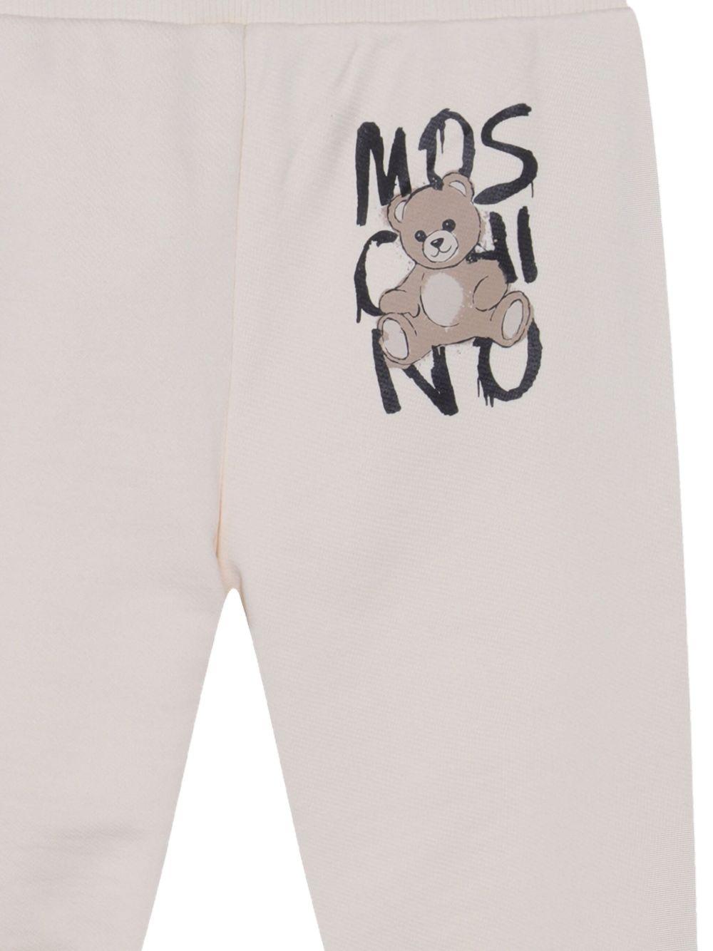 Pantaloni sportivi per bambino Moschino Kids bianco con stampa Teddy Bear - Rubino Kids
