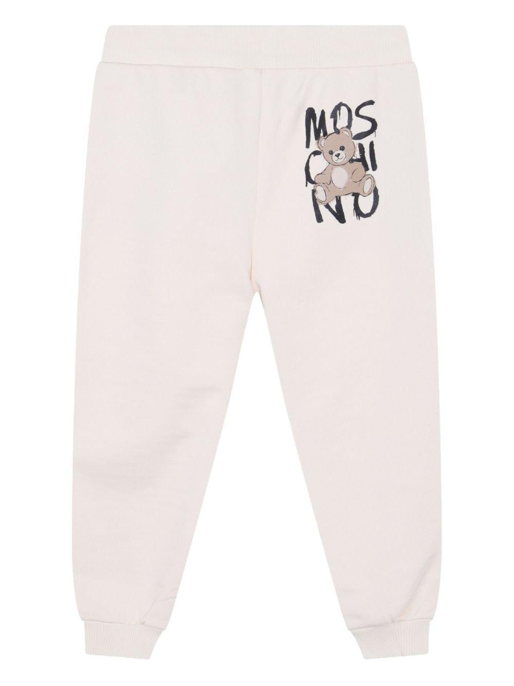 Pantaloni sportivi per bambino Moschino Kids bianco con stampa Teddy Bear - Rubino Kids