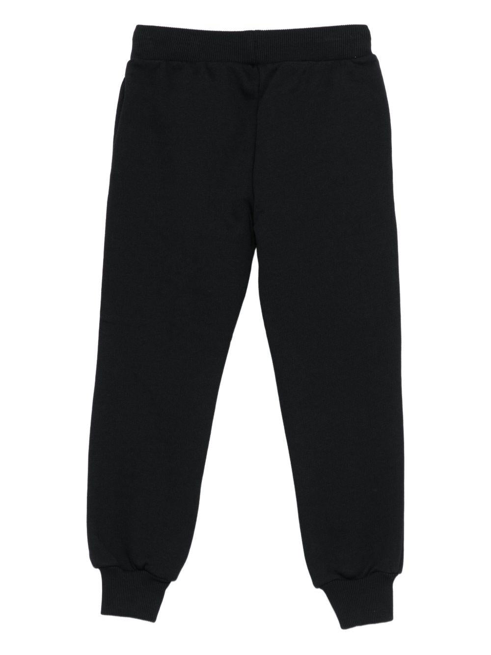 Pantaloni sportivi per bambino Moschino Kids nero con logo - Rubino Kids