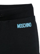 Pantaloni sportivi per bambino Moschino Kids nero con logo - Rubino Kids