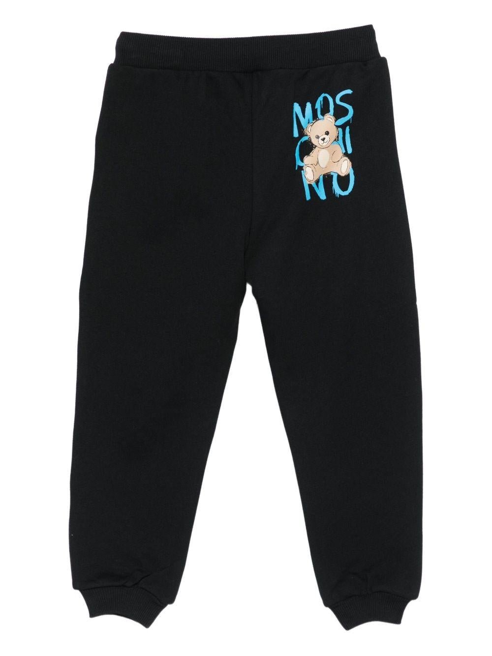 Pantaloni sportivi per bambino Moschino Kids nero con stampa Teddy Bear - Rubino Kids
