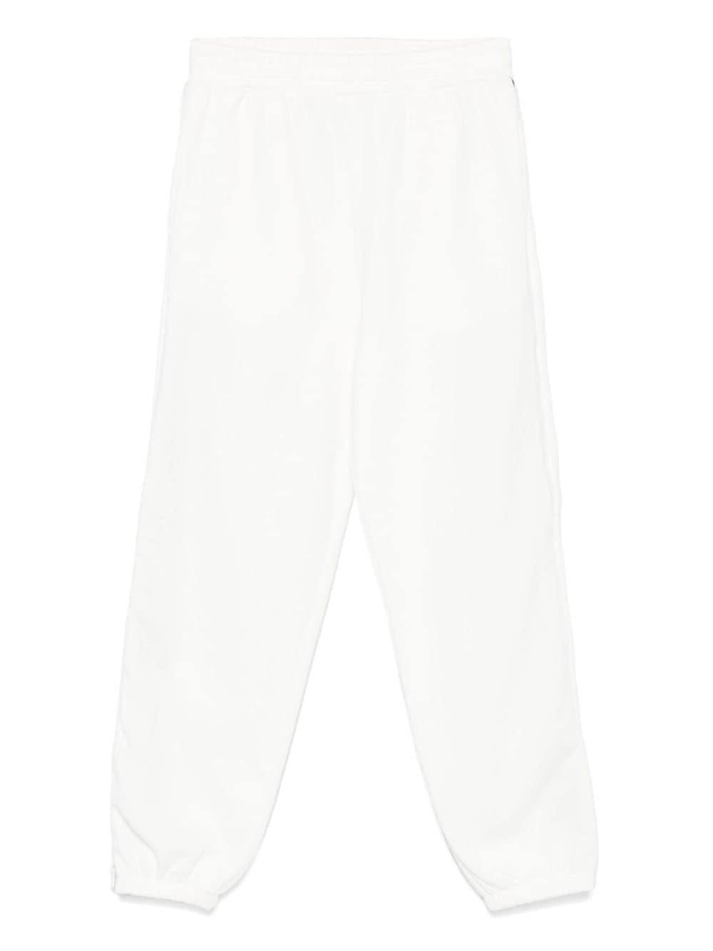 Pantaloni sportivi per bambino Stella McCartney Kids bianco con zip e decorazione sulla manica - Rubino Kids