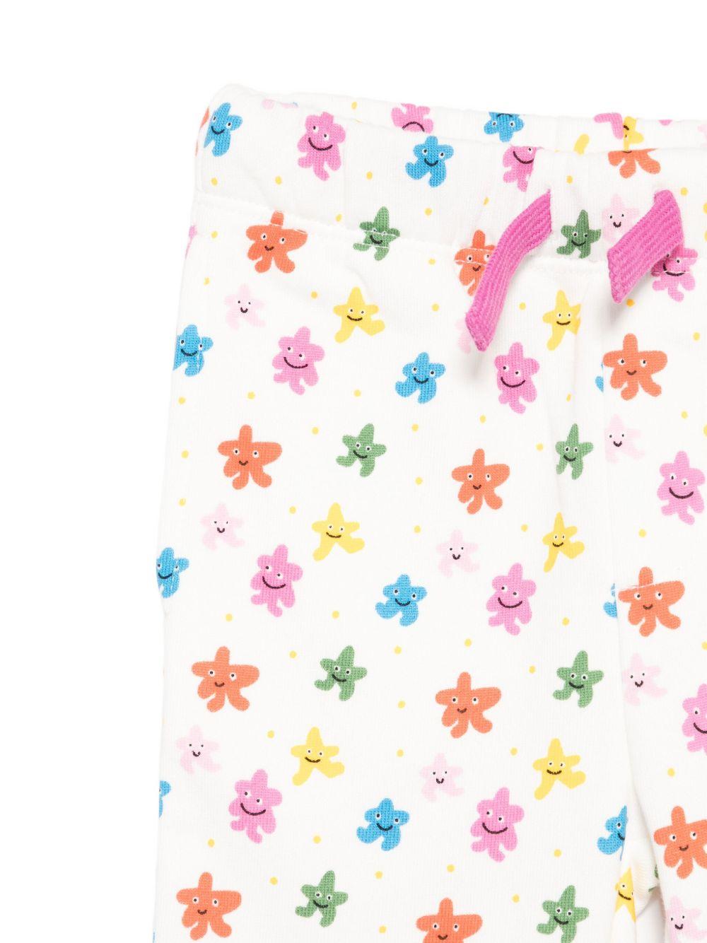 Pantaloni sportivi per neonata Stella McCartney Kids bianco con stelle all - over - Rubino Kids
