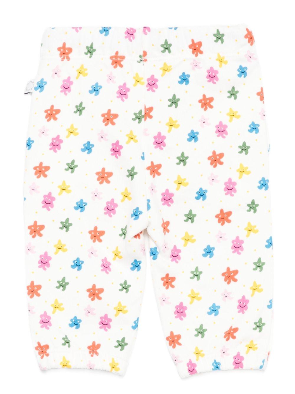Pantaloni sportivi per neonata Stella McCartney Kids bianco con stelle all - over - Rubino Kids