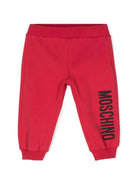 Pantaloni sportivi per neonati Moschino Kids rosso con logo sulla gamba - Rubino Kids