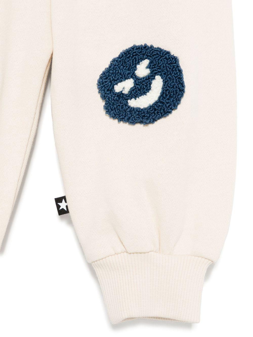 Pantaloni sportivi per neonato Molo Simeon beige con motivo smiley - Rubino Kids