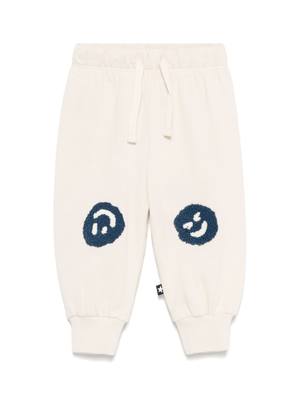 Pantaloni sportivi per neonato Molo Simeon beige con motivo smiley