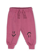 Pantaloni sportivi per neonato Molo Simeon rosa con stampa smiley - Rubino Kids