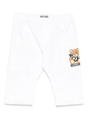 Pantaloni Teddy Bear per neonato Moschino Kids bianco con orlo con risvolto
