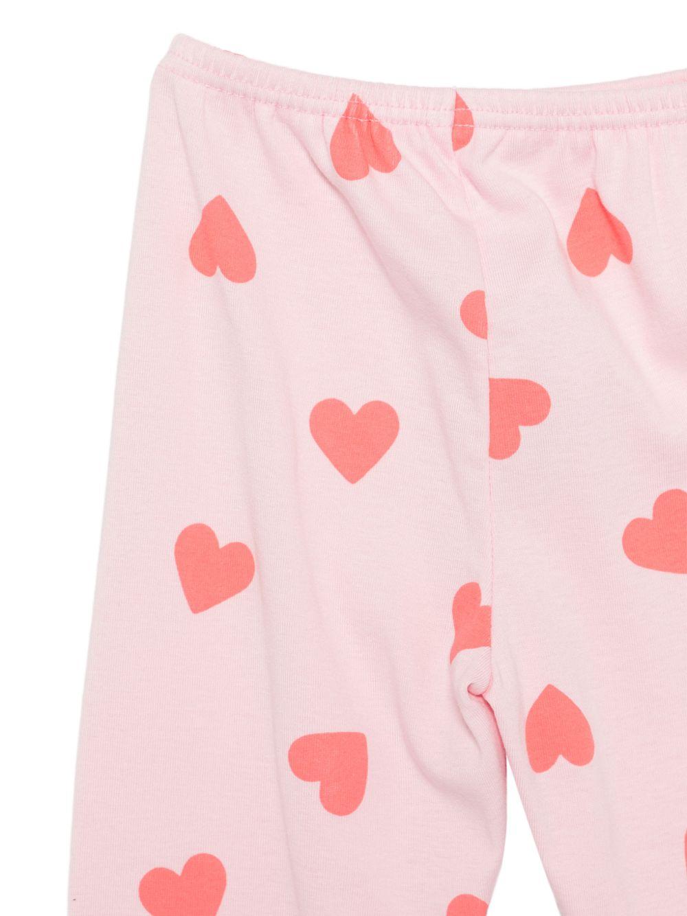 Pigiama per bambina Petit Bateau rosa con stampa a cuori all - over - Rubino Kids