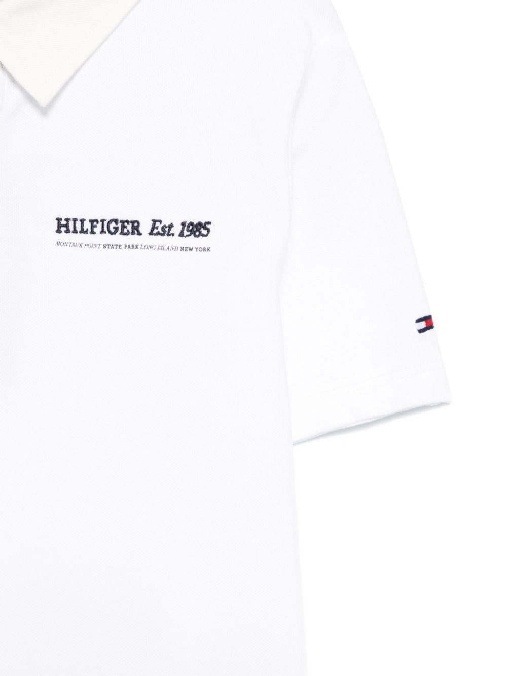 Polo con ricamo per bambino Tommy Hilfiger Junior bianco con spacchi laterali - Rubino Kids