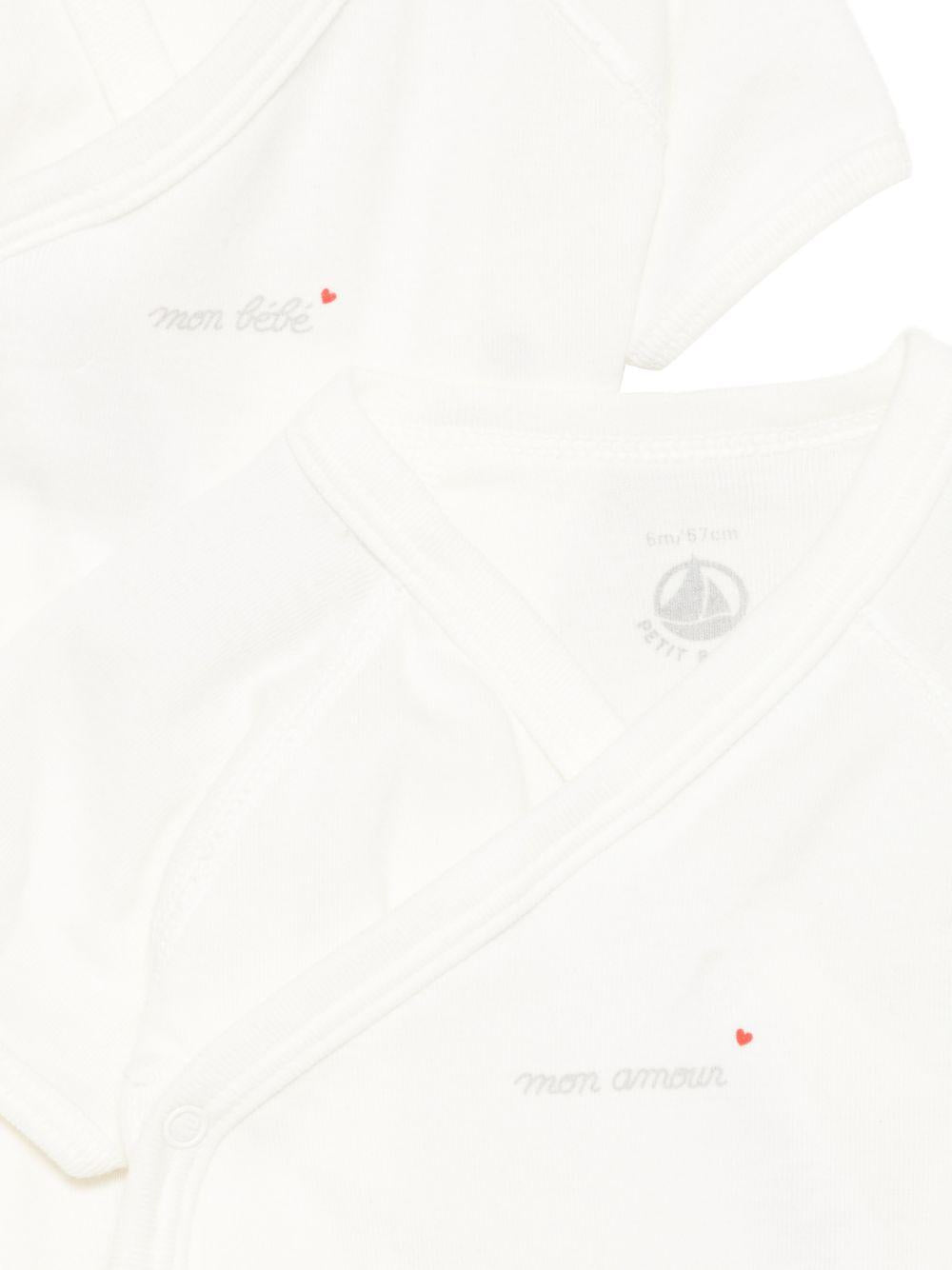 Set di cinque tutine per neonati Petit Bateau bianche con scollo a V - Rubino Kids