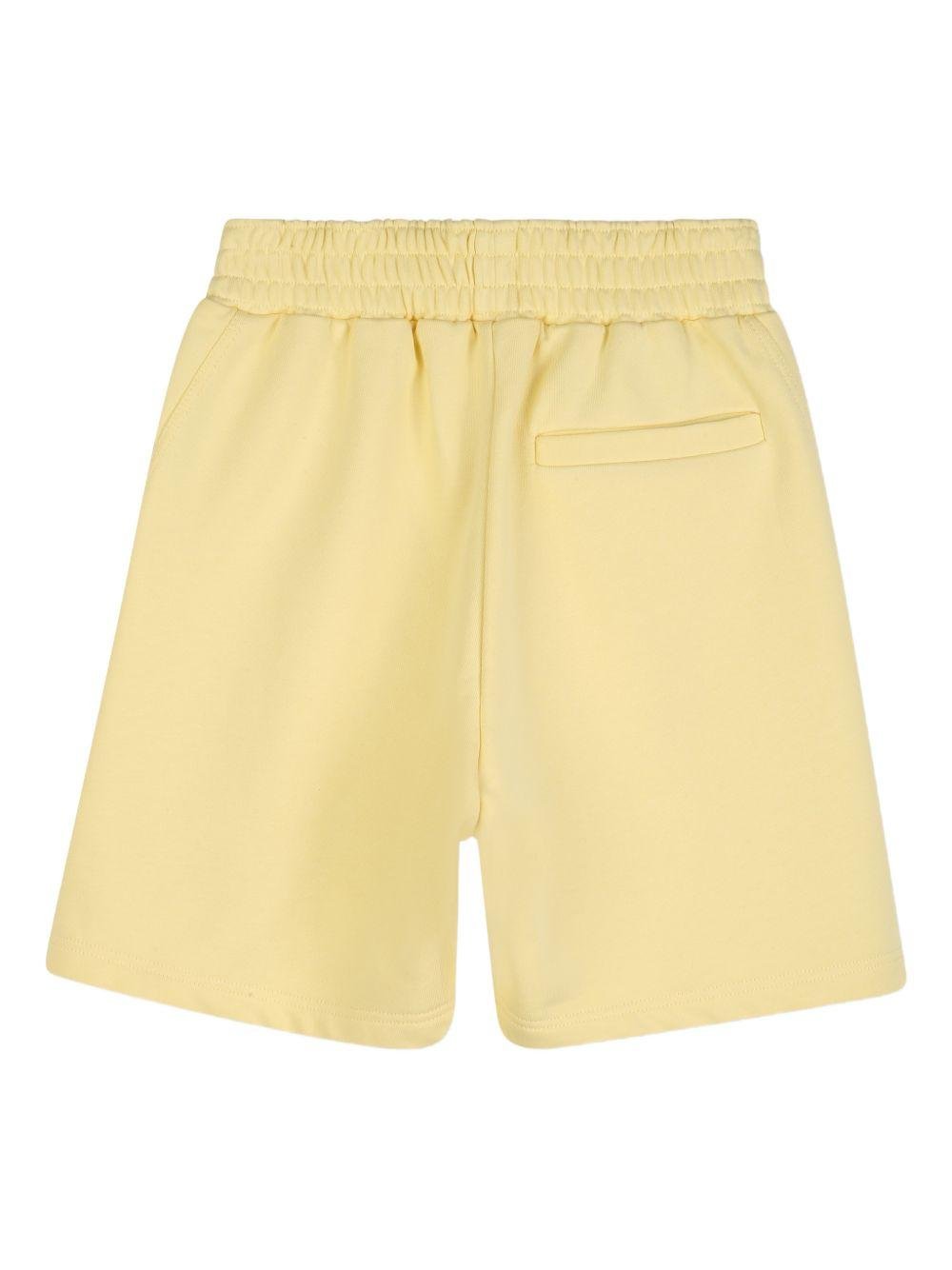Shorts per bambino Givenchy Kids giallo con stampa logo - Rubino Kids