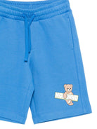 Shorts per bambino Moschino Kids azzurri con logo sul davanti - Rubino Kids