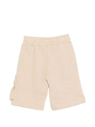 Shorts per bambino Moschino Kids beige con logo sul davanti - Rubino Kids