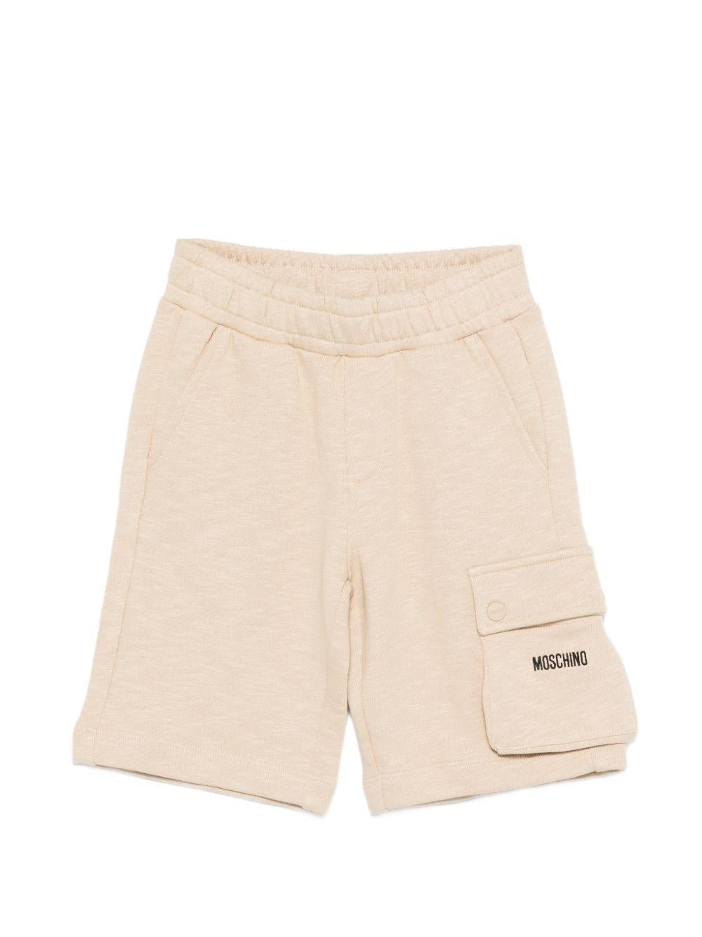 Shorts per bambino Moschino Kids beige con logo sul davanti - Rubino Kids