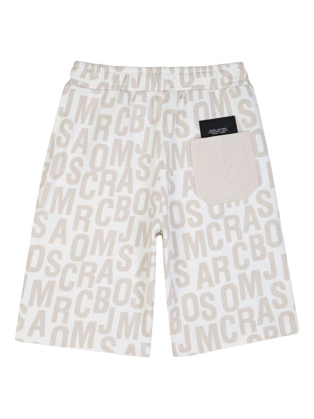 Shorts per bambino The Marc Jacobs Kids con stampa beige chiaro logo all - over - Rubino Kids