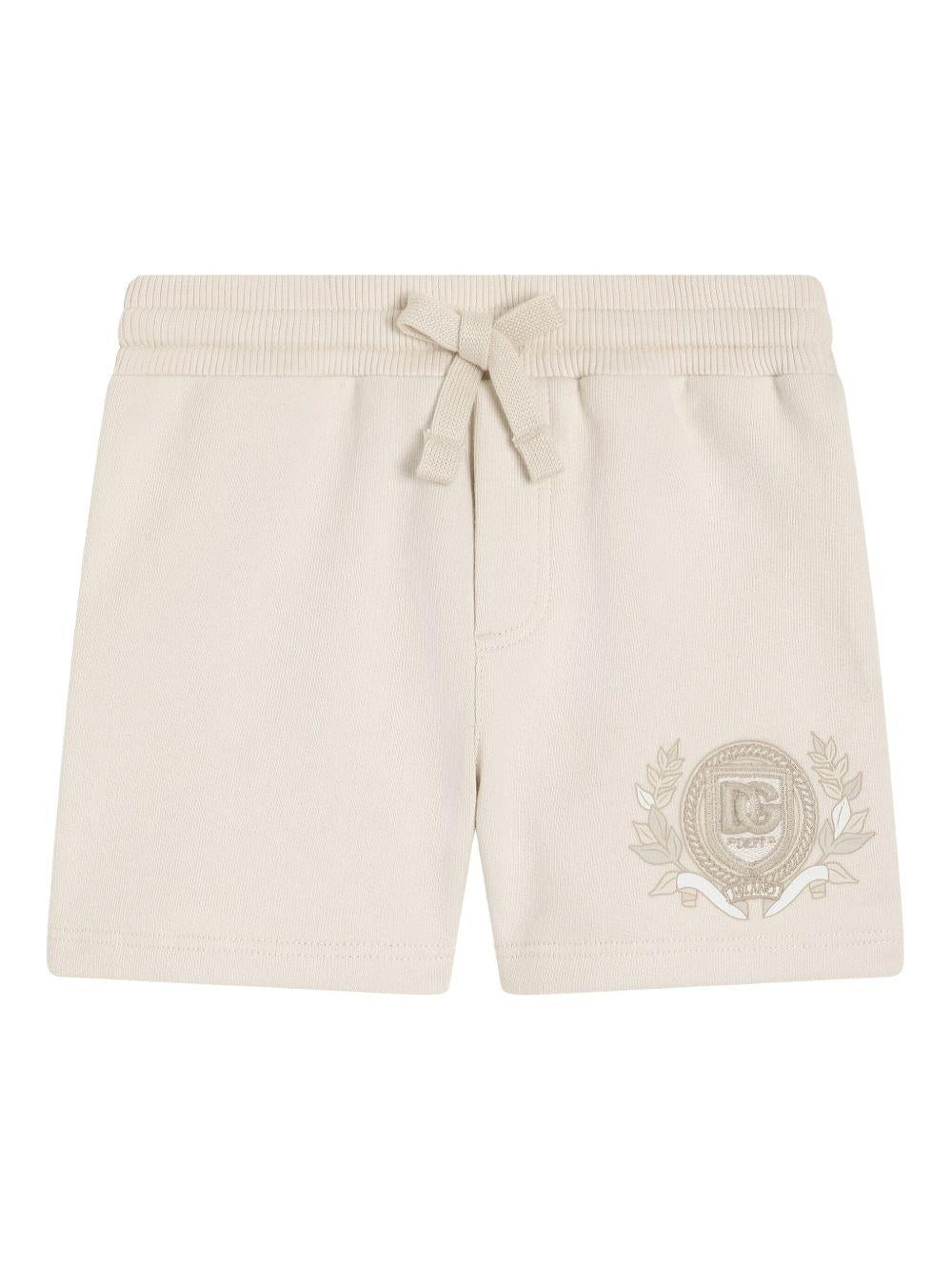 Shorts per neonato Dolce & Gabbana Kids beige con logo sulla gamba - Rubino Kids