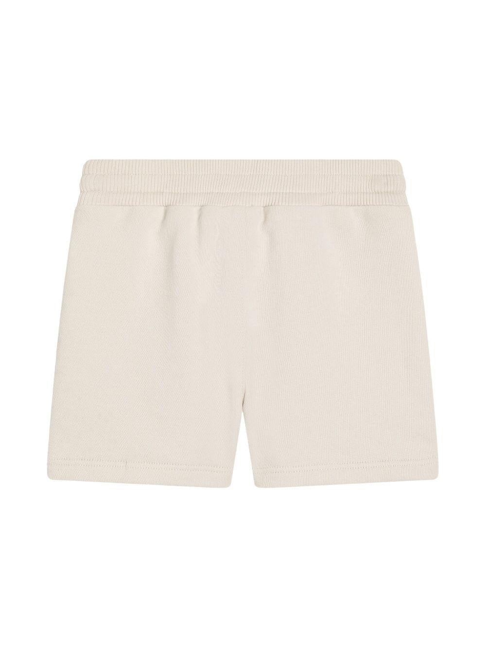 Shorts per neonato Dolce & Gabbana Kids beige con logo sulla gamba - Rubino Kids