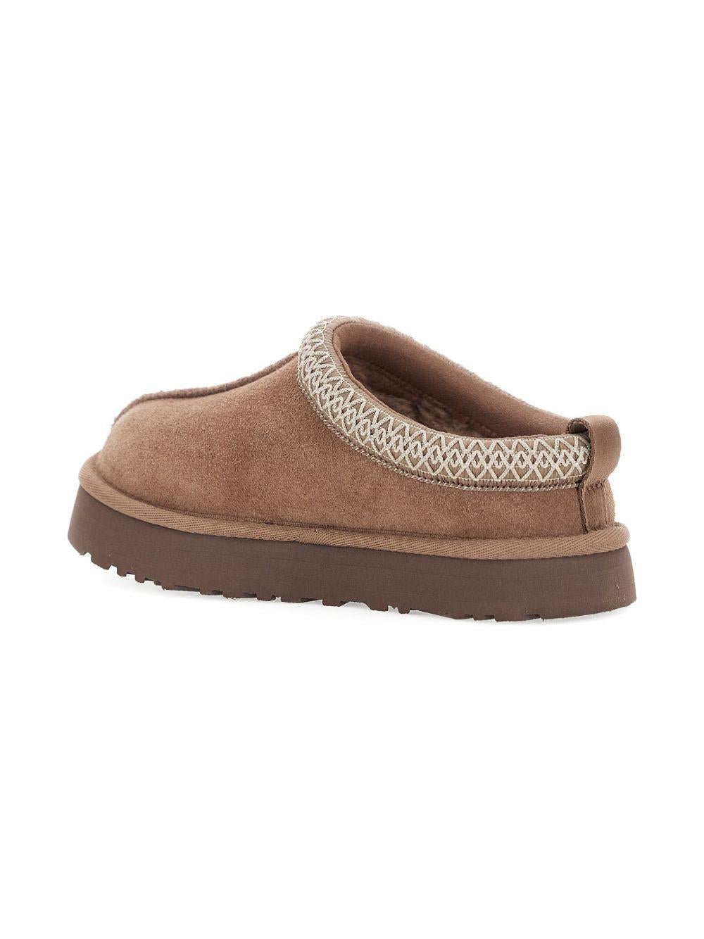 Slippers Tazz per bambini UGG Kids beige con rifiniture intrecciate - Rubino Kids