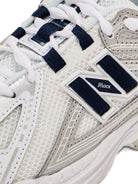 Sneakers 1906 per bambino New Balance Kids bianche con applicazione con logo - Rubino Kids