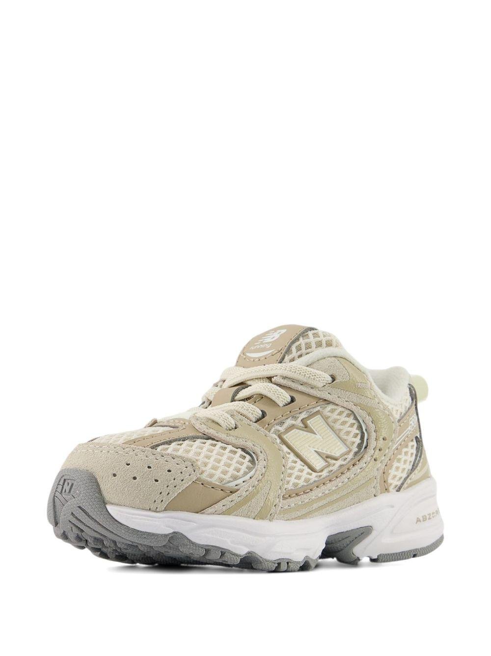 Sneakers 530 per bambini New Balance Kids beige con design a inserti - Rubino Kids