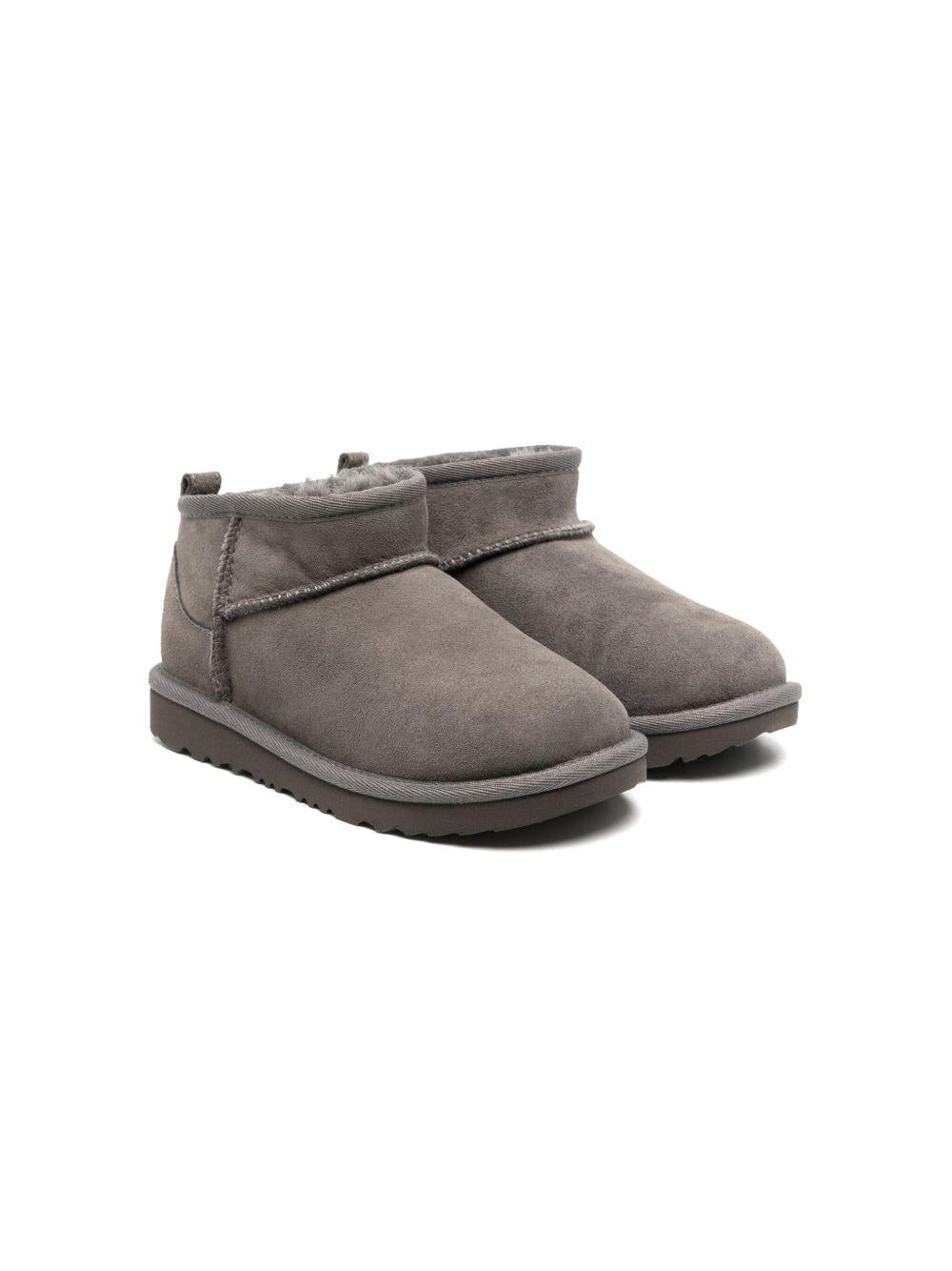 Stivali Ultra Mini per bambina UGG Kids grigi con design slip - on - Rubino Kids
