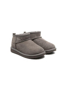 Stivali Ultra Mini per bambina UGG Kids grigi con design slip - on - Rubino Kids