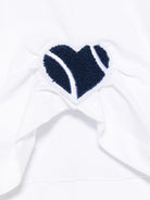 T-shirt con applicazione a cuore per bambina Monnalisa bianco con orlo asimettrico - Rubino Kids