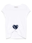 T-shirt con applicazione a cuore per bambina Monnalisa bianco con orlo asimettrico - Rubino Kids