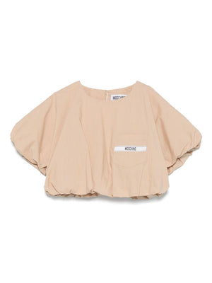 T-shirt con logo per bambina Moschino Kids beige con design crop