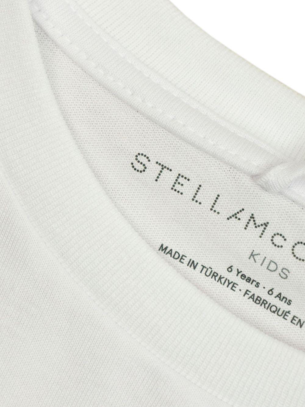 T-shirt crop per bambina Stella McCartney Kids bianco con stampa grafica - Rubino Kids