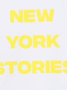 T-shirt per bambina Dkny Kids bianca con scritta sul davanti - Rubino Kids