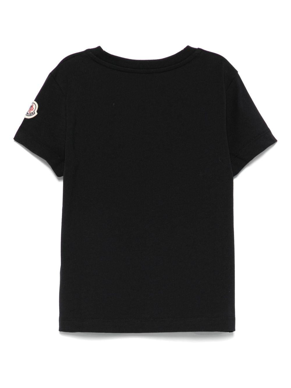 T-shirt per bambina Moncler Enfant nera con logo in rilievo e toppa sulla manica - Rubino Kids
