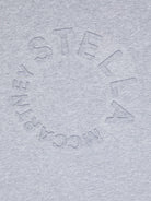 T-shirt per bambina Stella McCartney Kids grigia con logo goffrato sul davanti - Rubino Kids