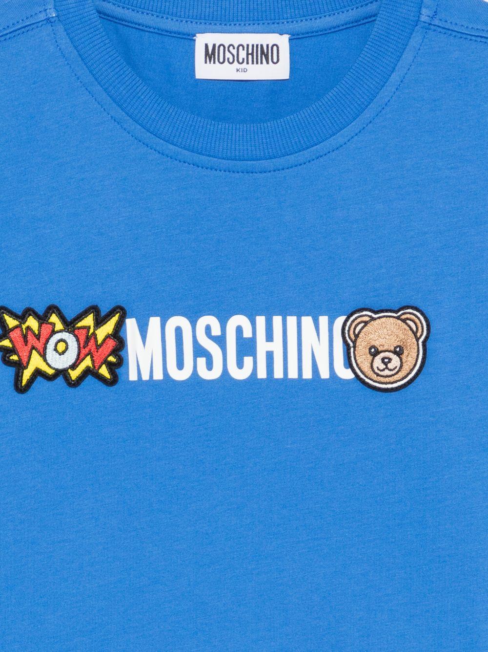 T-shirt per bambini Moschino Kids azzurra con logo sul davanti - Rubino Kids