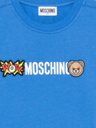 T-shirt per bambini Moschino Kids azzurra con logo sul davanti - Rubino Kids