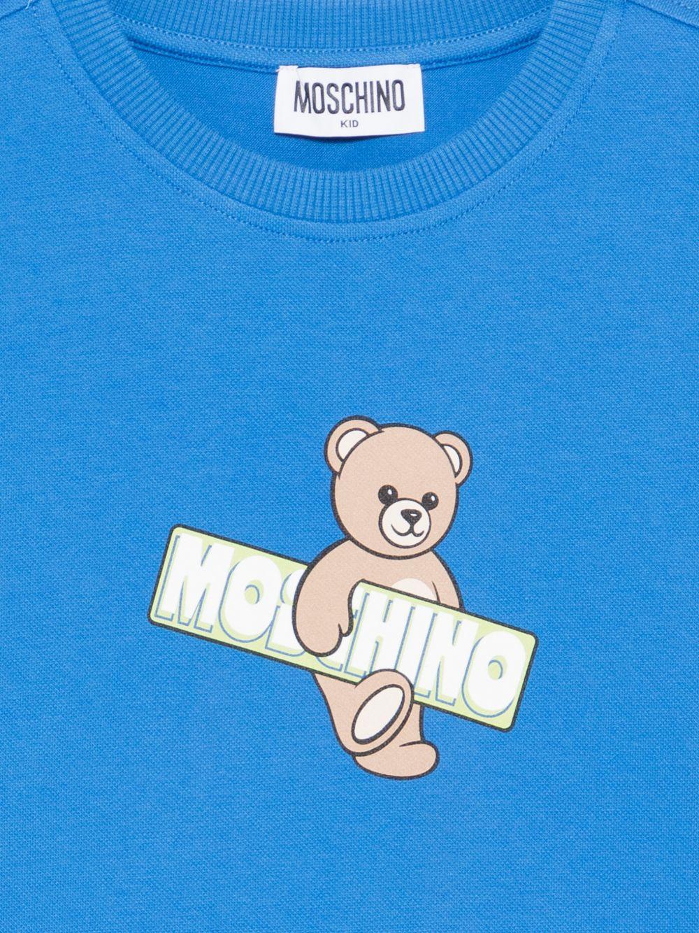 T-shirt per bambini Moschino Kids azzurra con stampa Teddy Bear sul davanti - Rubino Kids