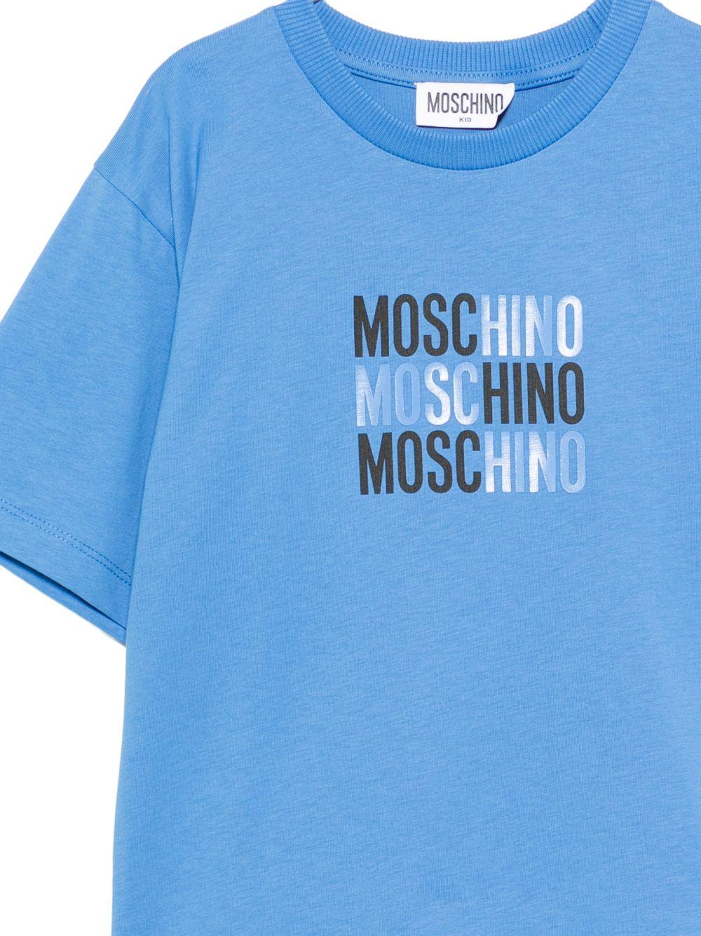 T-shirt per bambini Moschino Kids azzurro con logo sul davanti - Rubino Kids
