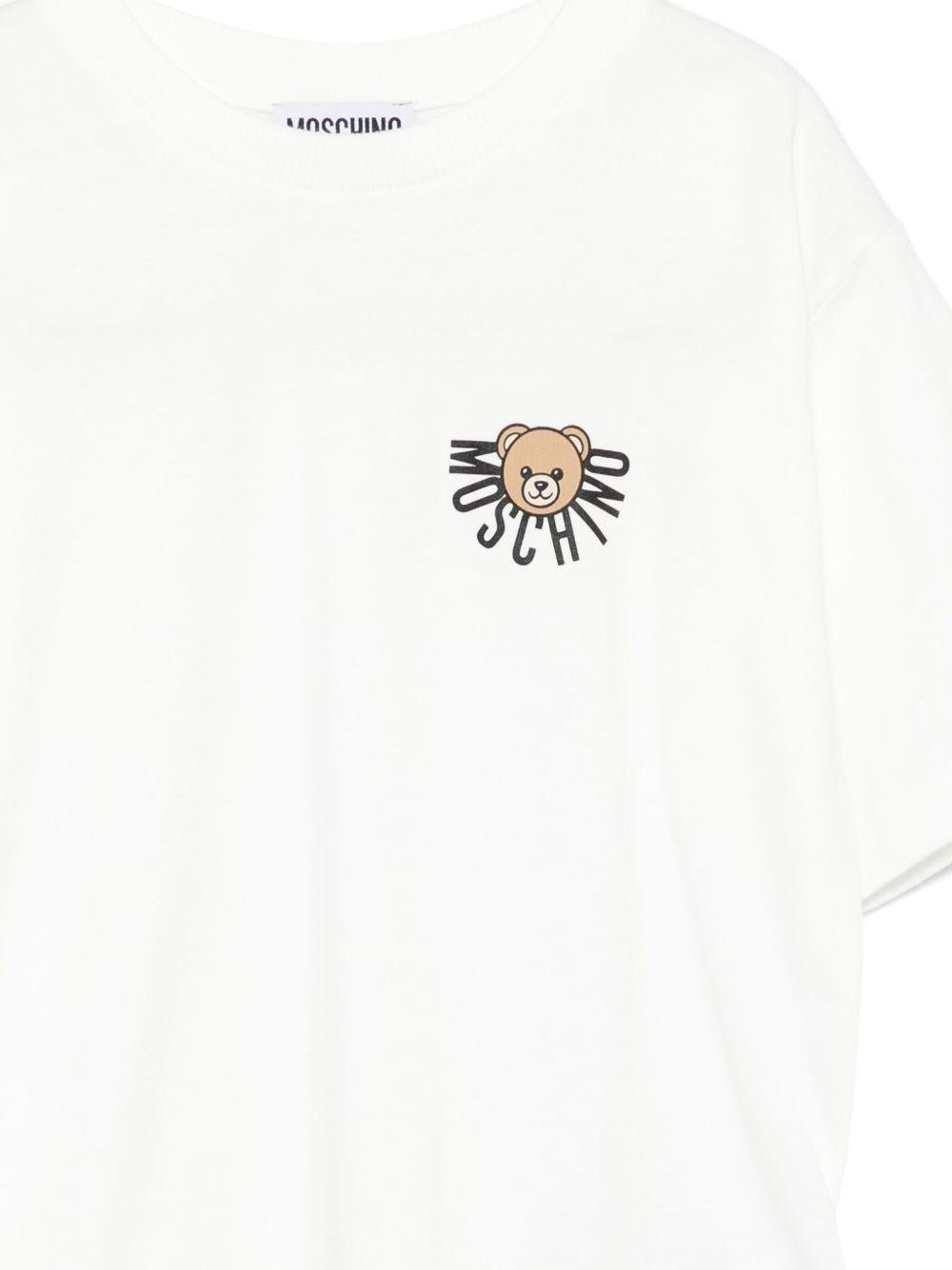 T-shirt per bambini Moschino Kids bianca con logo e teddy - Rubino Kids